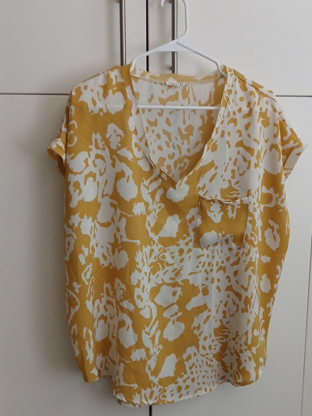 JODIFL Mustard and White Animal Print V-Neck Blouse